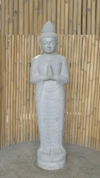 Product image of the product “Standing Buddha made of Riverstone, position Namaskara , H. 185cm. There is a stone eye on the right thight. ”